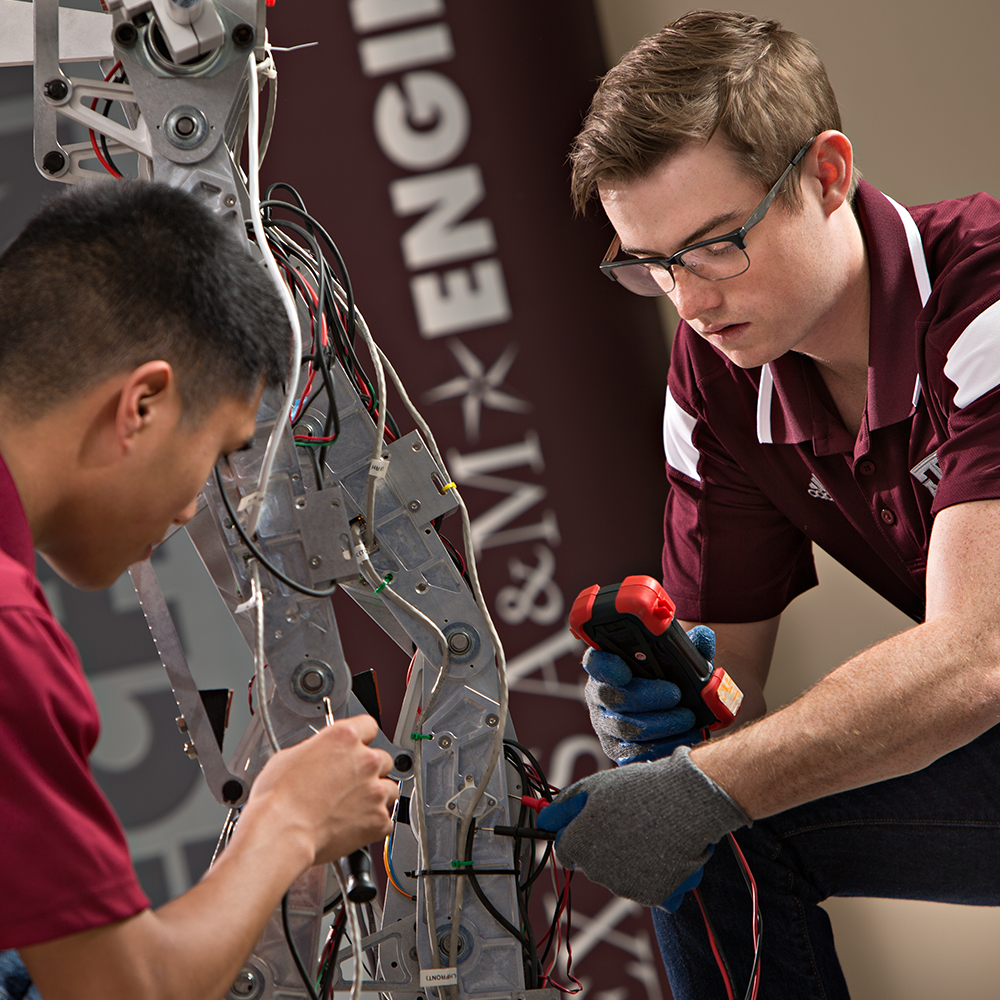 engineering students working on robotic limb