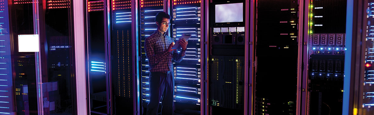 Young man in server room