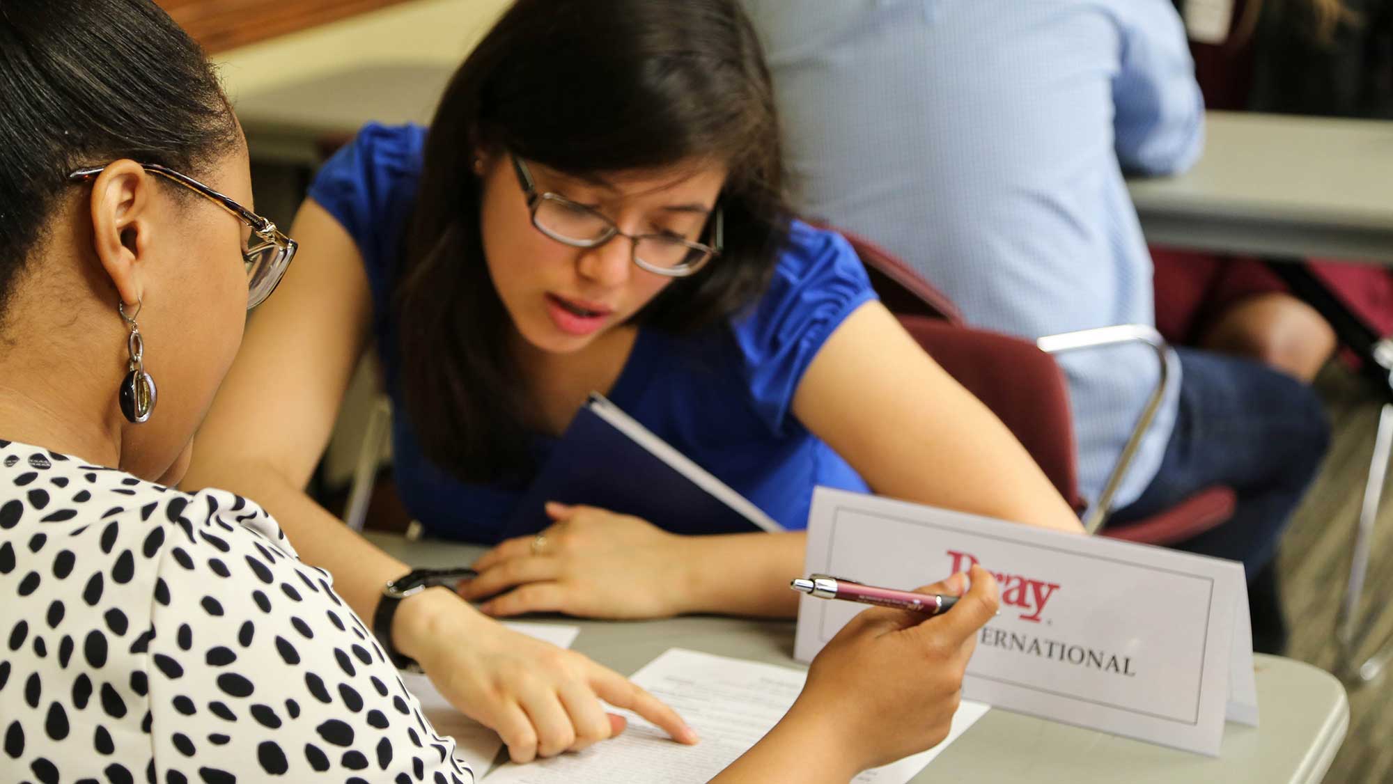 students mentoring each other at an engineering event