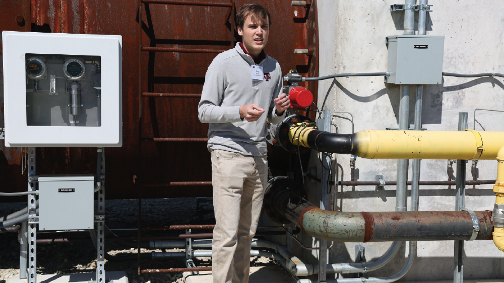 student standing in front of the detonation testing research facility 