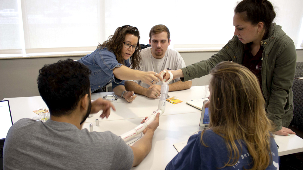 Group of students working in design studio