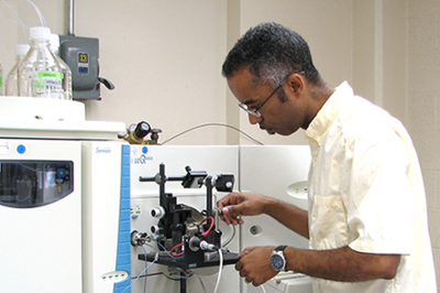 Man with mass spectrometry machine