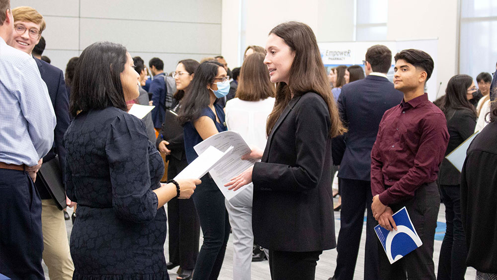 A student interacting with a recruiter