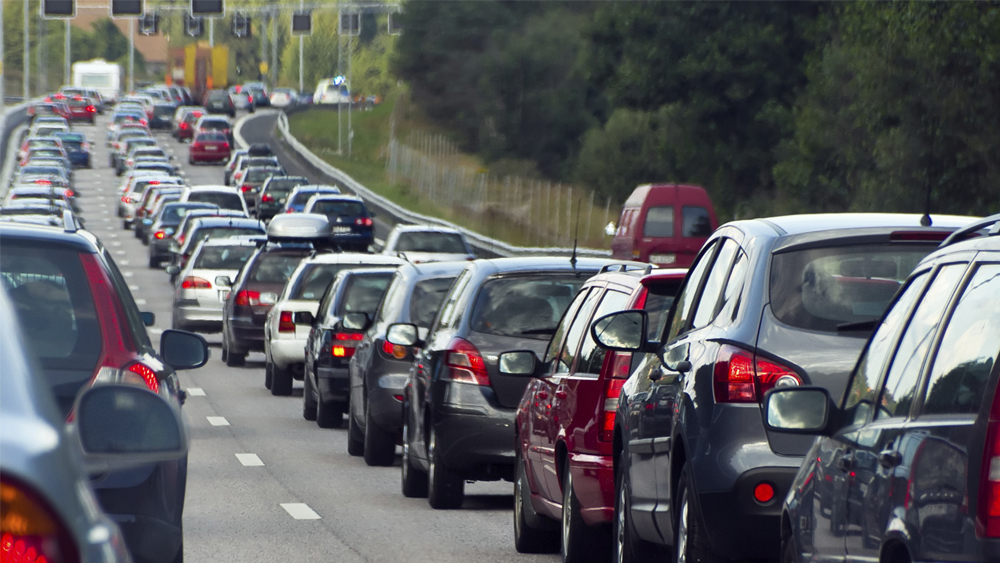 Vehicles in lines of traffic on a road 