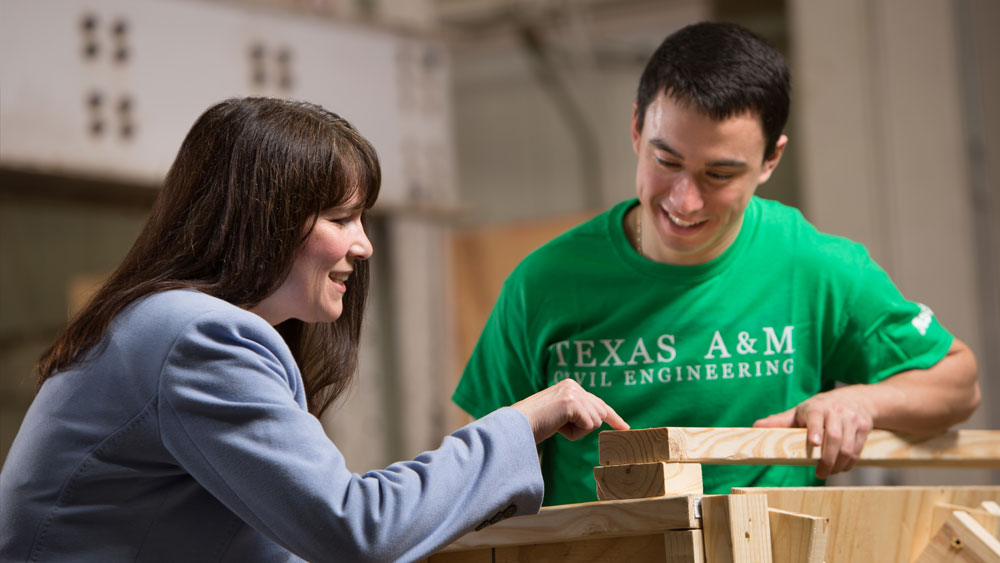 A faculty member and student in a construction lab