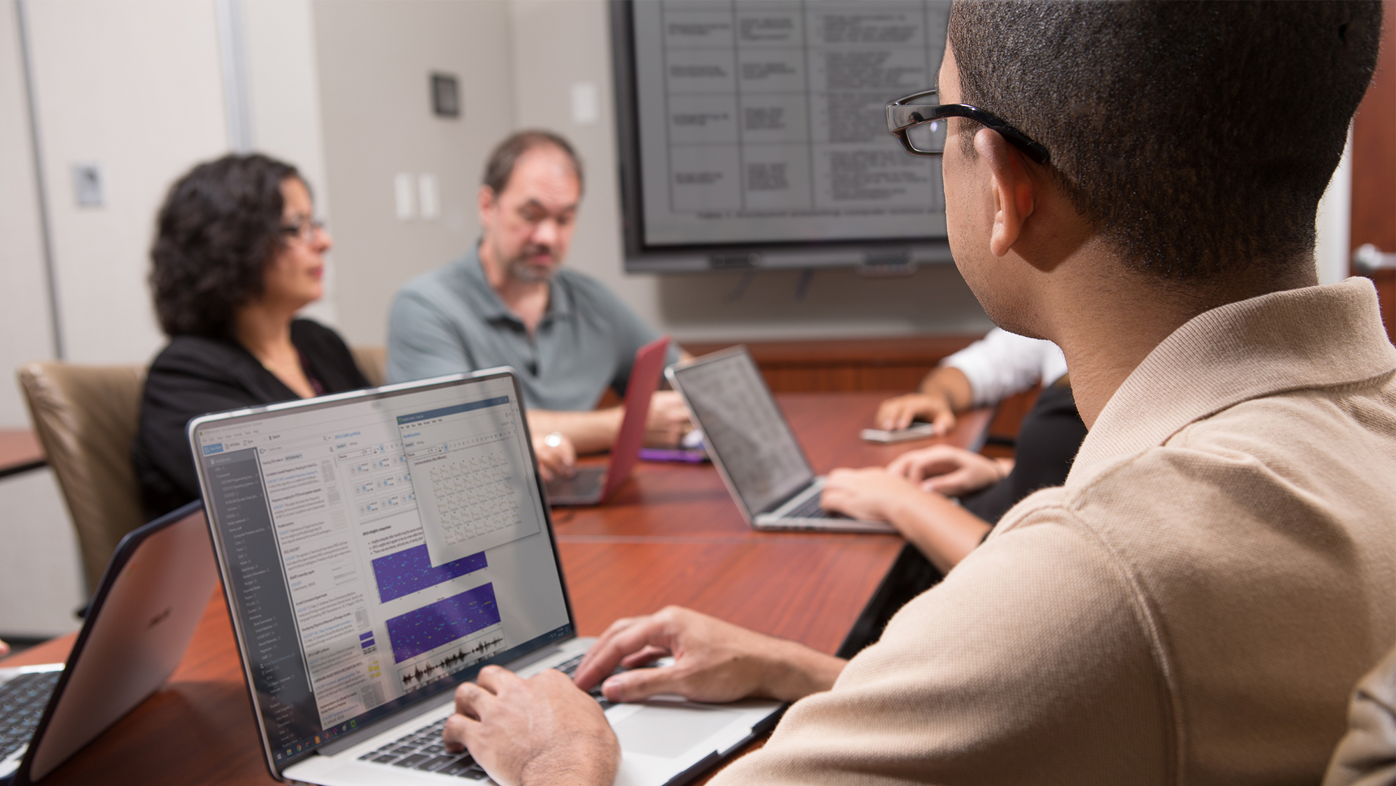 Image of faculty having discussion.