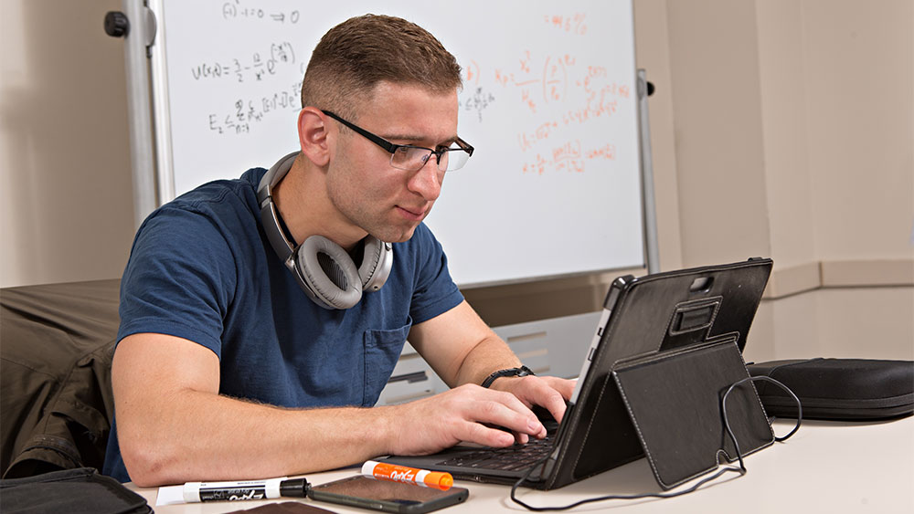 Man typing on a keyboard. 