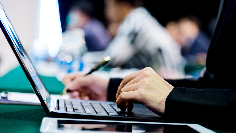 A person typing on a computer.