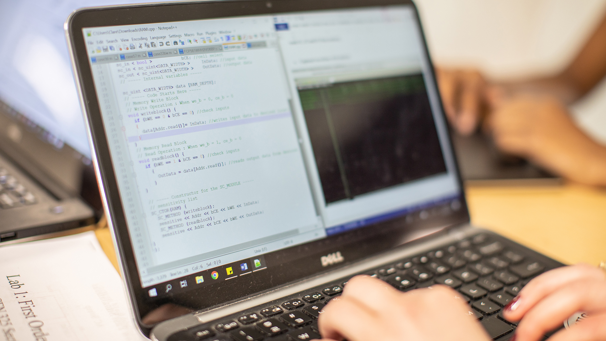 laptop screen featuring computer script and coding