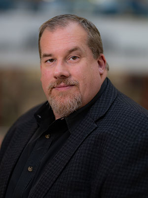 Headshot of John Lusher