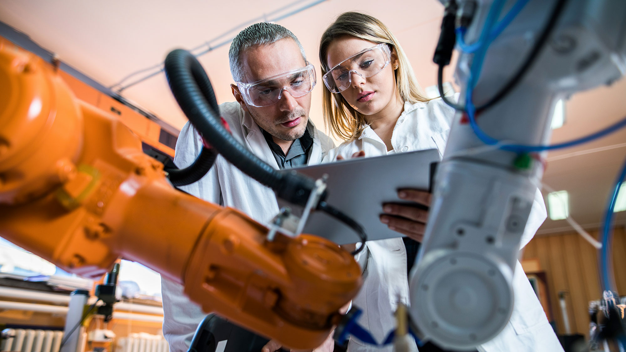 Two lab workers working together in laboratory.