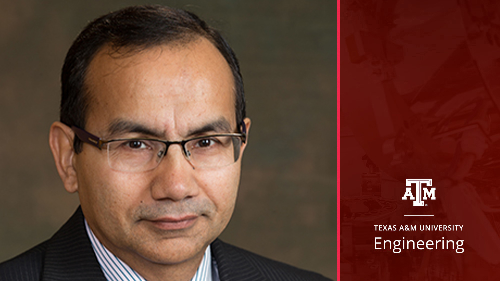 A man wearing a suit and glasses with a maroon side bar and the logo of Texas A&M Engineering