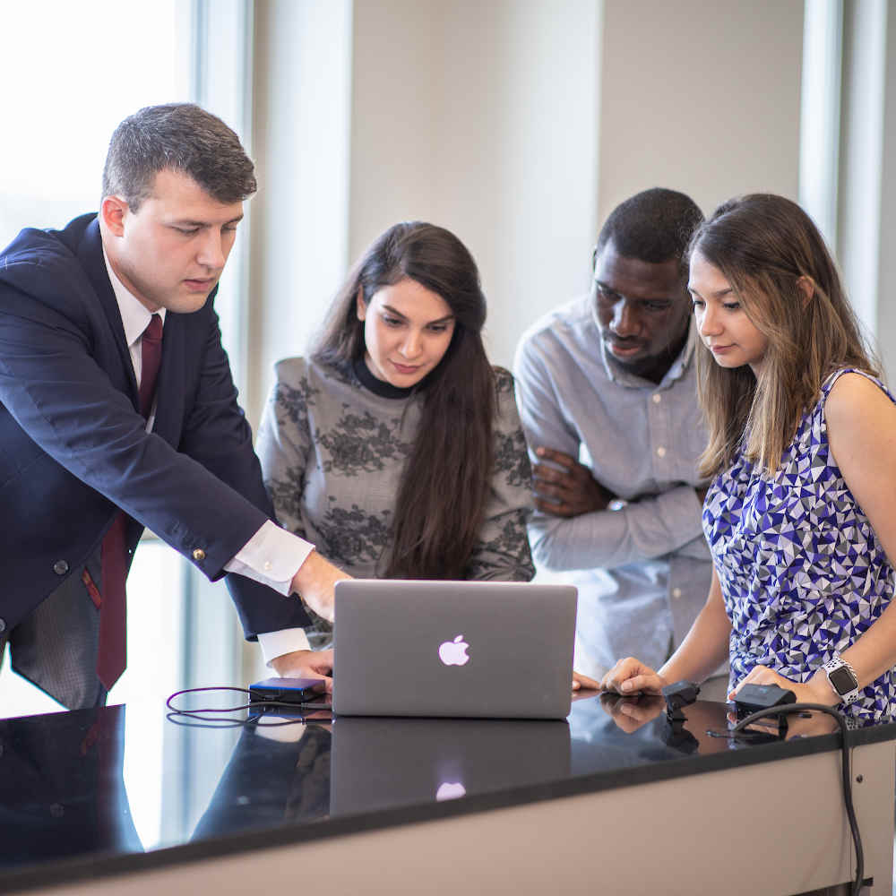 Students in front of a laptop 