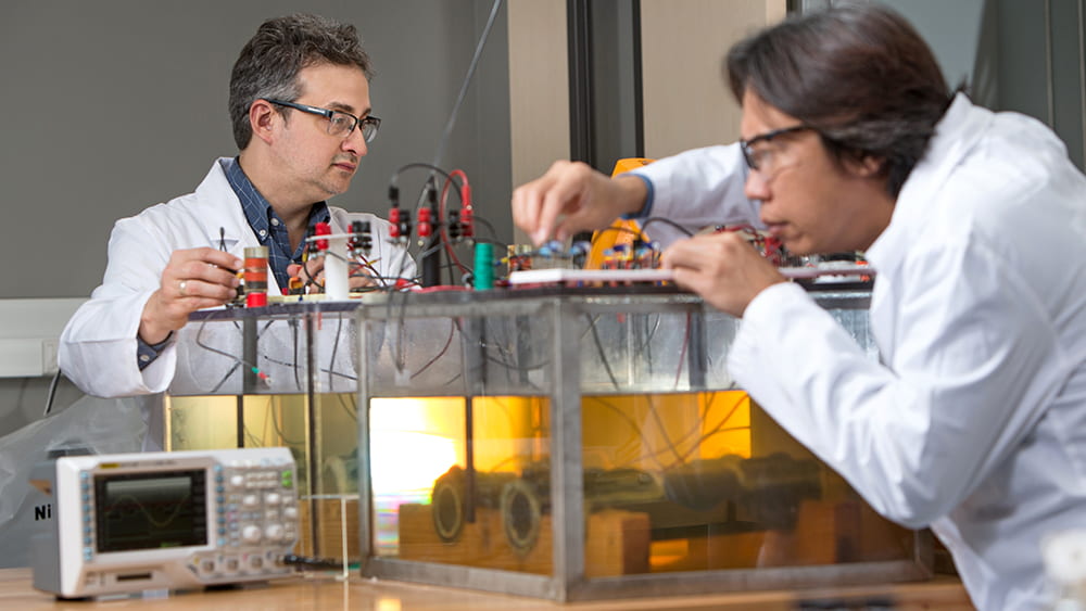 Researchers work in corrosion lab