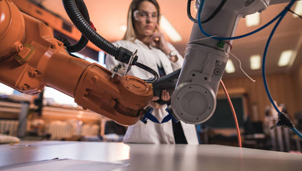 Female standing in robotics lab