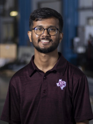 A man wearing a Texas A&amp;M polo shirt.