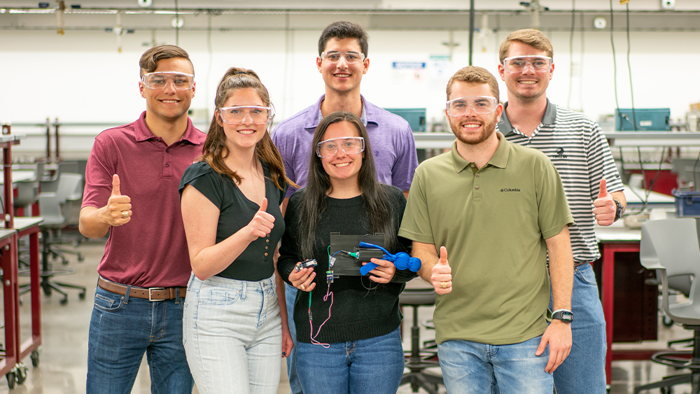 Students showing their Capstone Senior Design project 