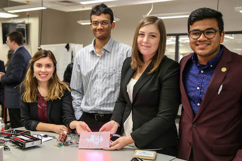 Four students with their product