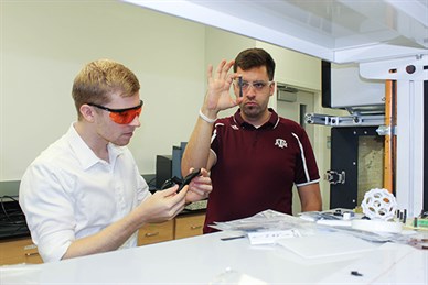 Sweeney and Blake Tiepel working in the lab