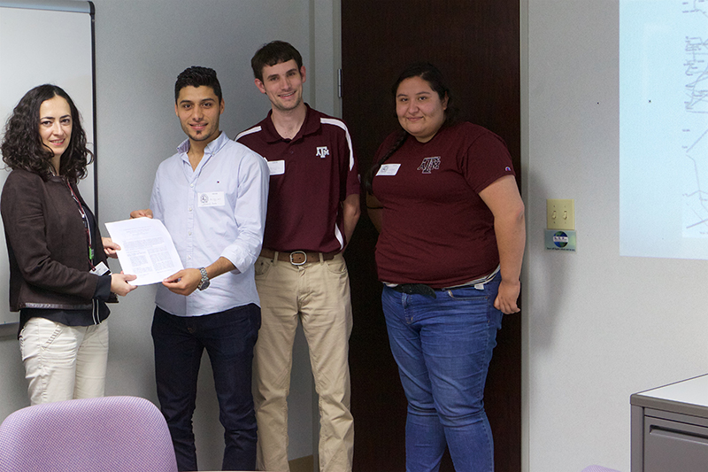 Students present findings on conditional risk assessment for blackouts during severe weather