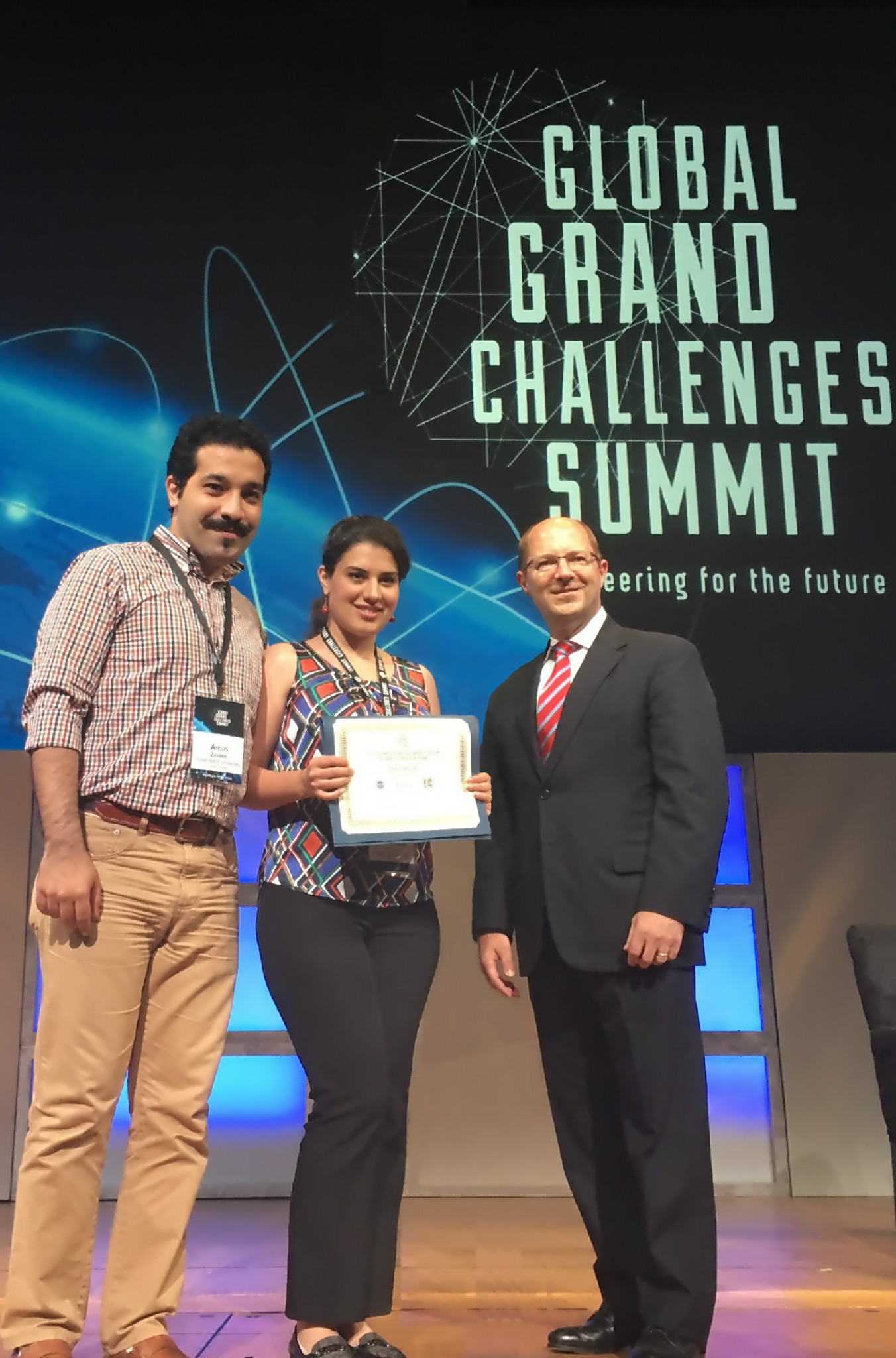 Rana Soltani-Zarrin and Amin Zeiaee receiving Excellence in Societal/Technical Impact Award 