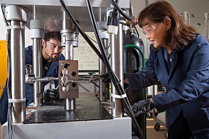 Dr. Ding Zhu and graduate student Ryan Winner shown in fracture conductivity lab with equipment