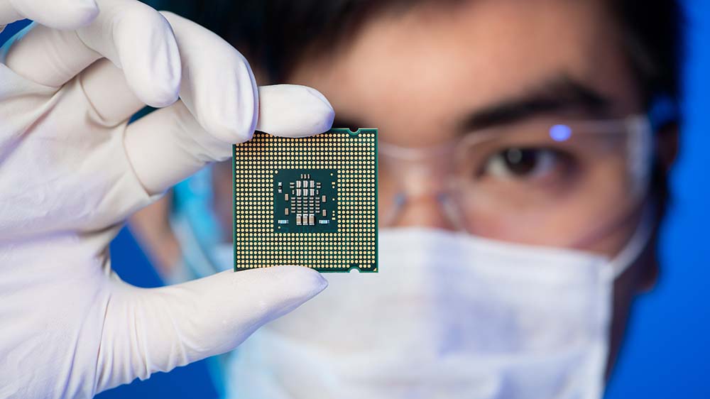 Researcher displaying computer chip