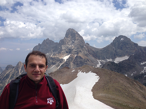 Dr. Ragusa at the top of a mountain.