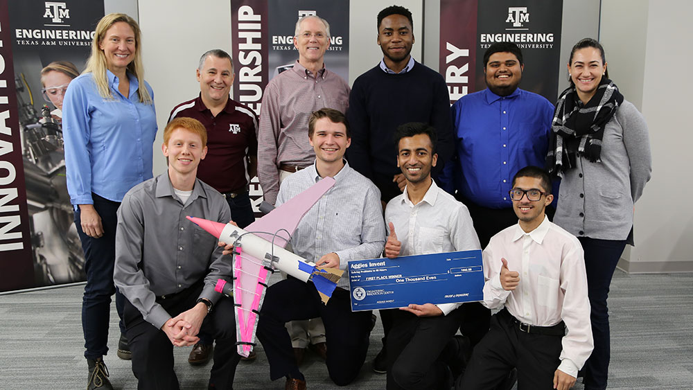 Students posing for the camera with their prototype. 