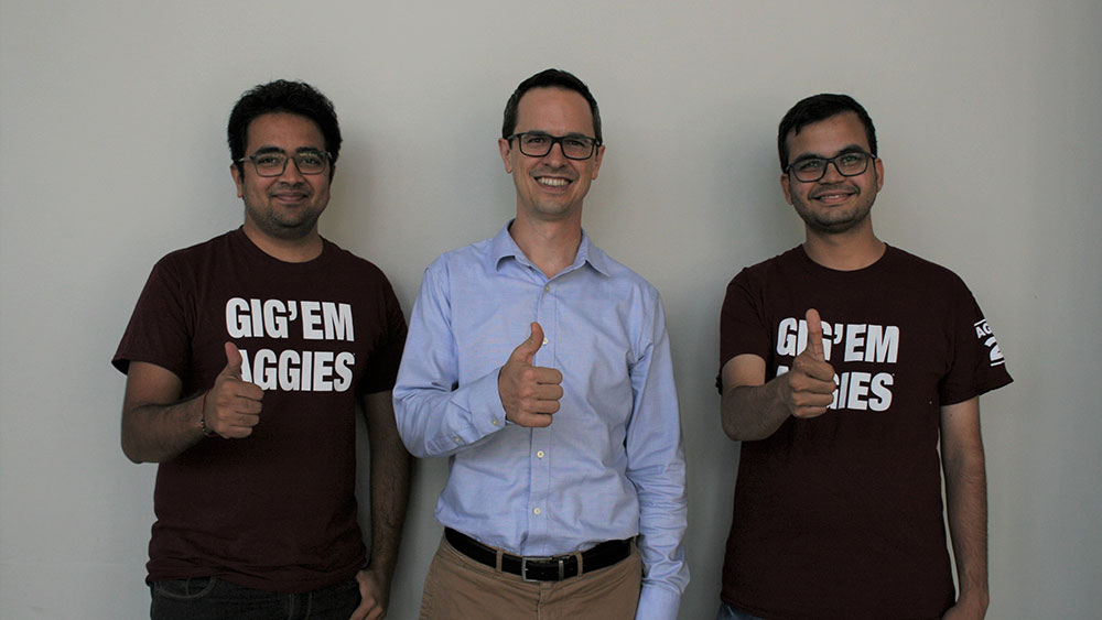 Dr. Andrew Johnson and graduate students Nishat Unmeshbhai Mehta and Salil Vijay Rajwade