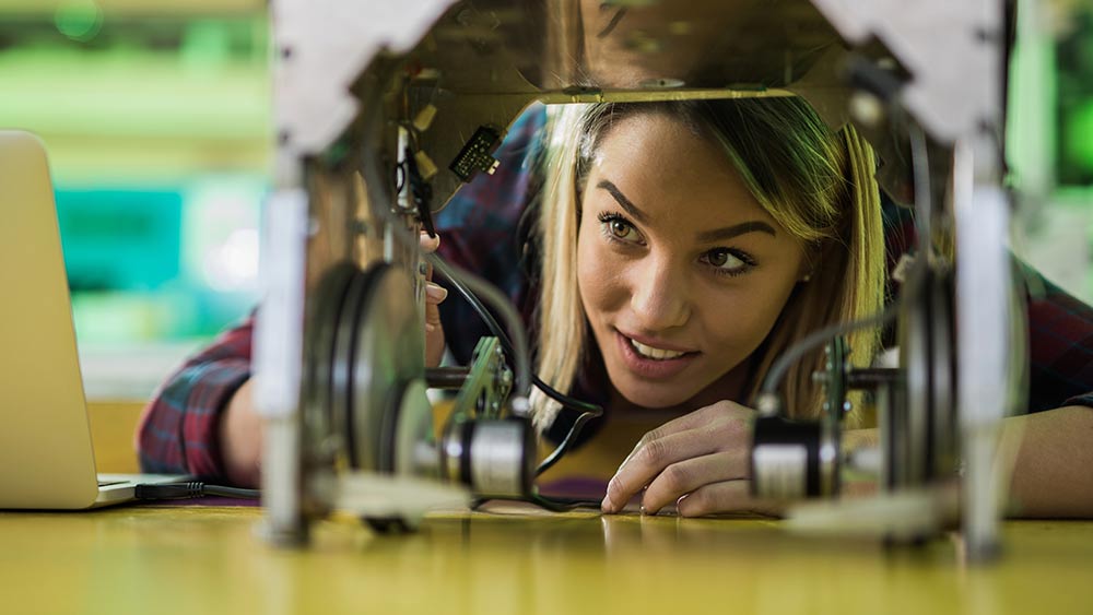 Under graduate student working on a machine