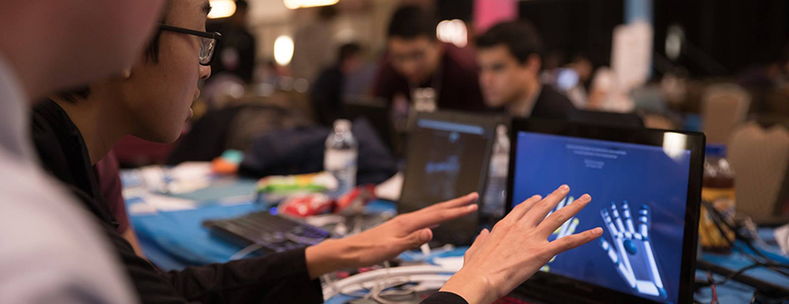 Students collaborating for hackathon competition