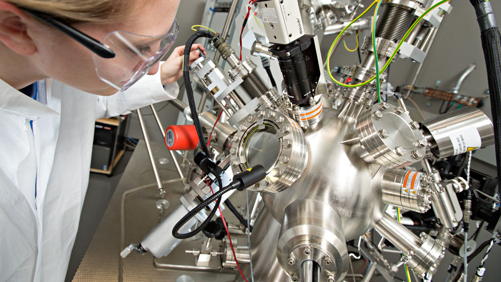 A student working on a mechanical machine