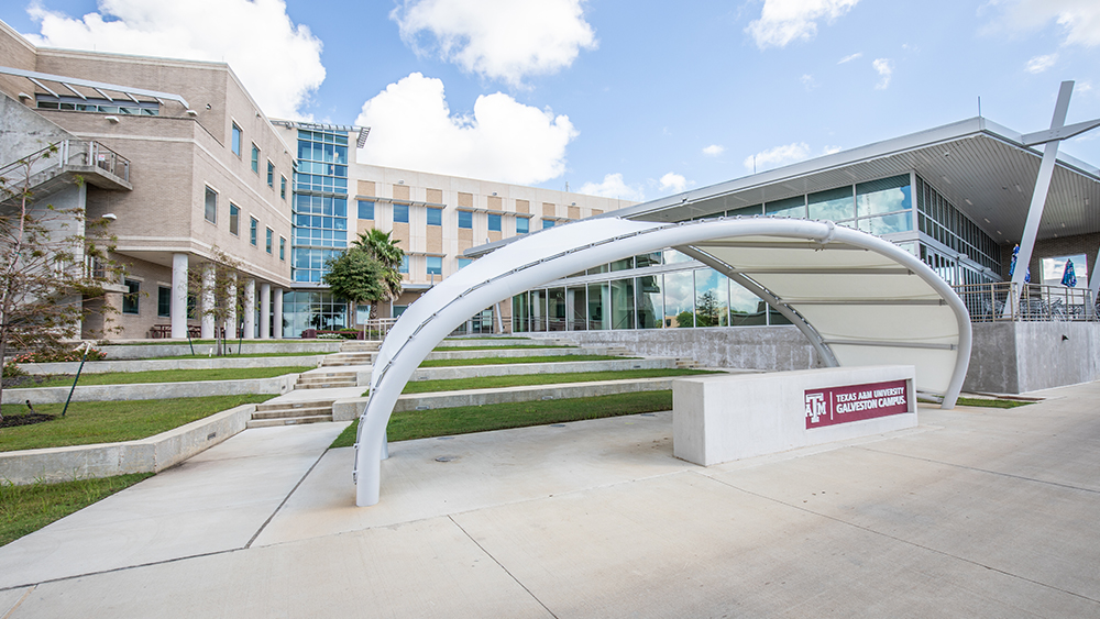 A sign in front of the Galveston campus that says Texas A&M University Galveston Campus