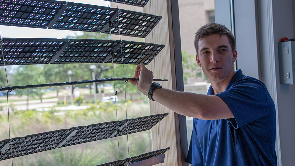 Capstone team member Zachary Merrill demonstrating the team's project