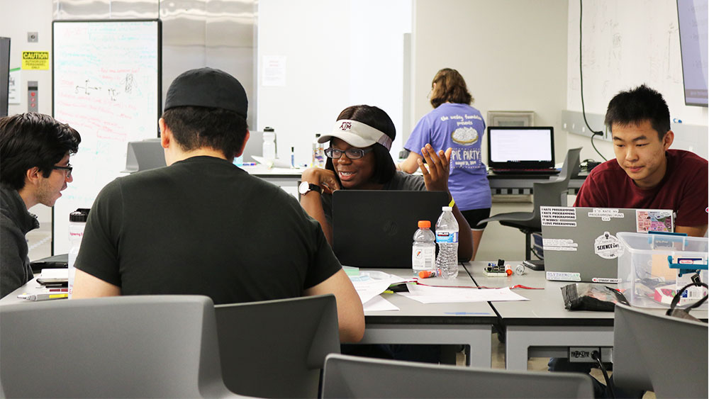 Group of students discussing team project at Aggies Invent - Nuclear Security.