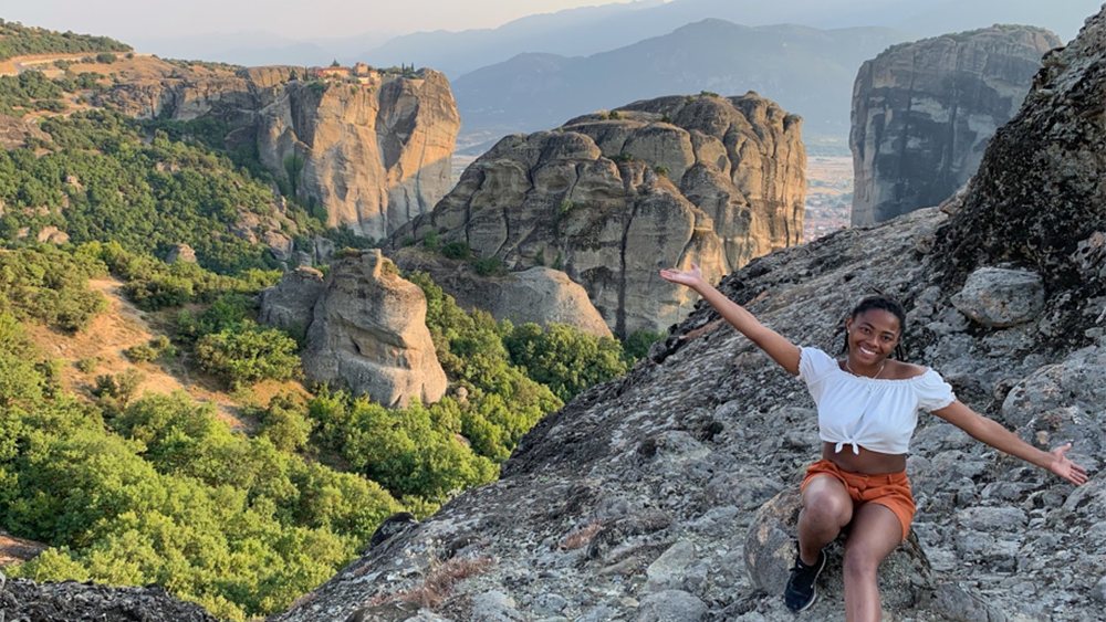 Student near cliff in Greece during a study abroad. 