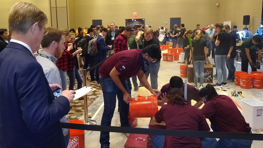 GeoWall members use engineering principles to build a model stable earthen structure during the competition.