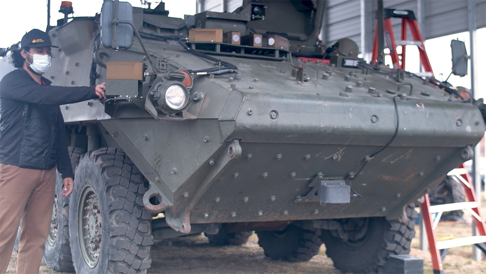 A man works to test the mechanics on an Army tank. 