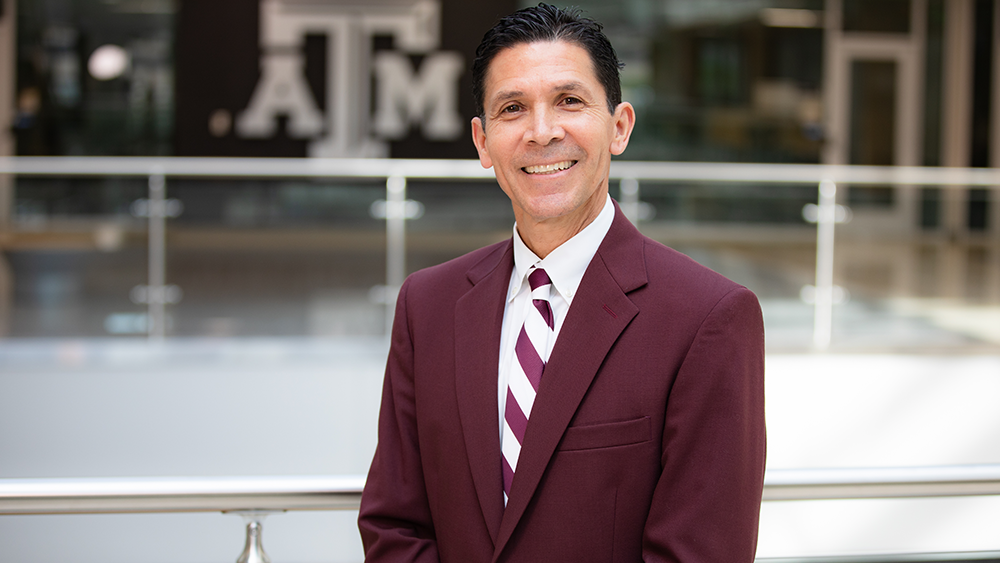 Dr. Hurtado smiles for a photo inside the Zachry building