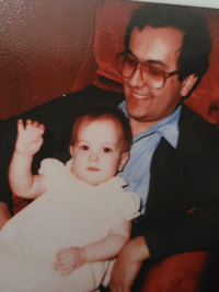 Walid Azzam holding Rhie Azzam in 1984. 