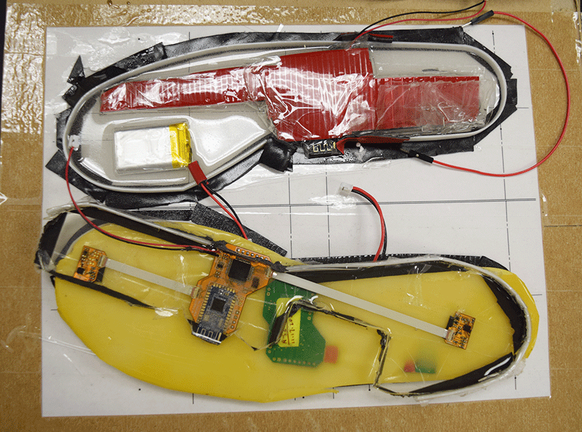 The inside of shoe insole technology fitted with various microchips and wires. 