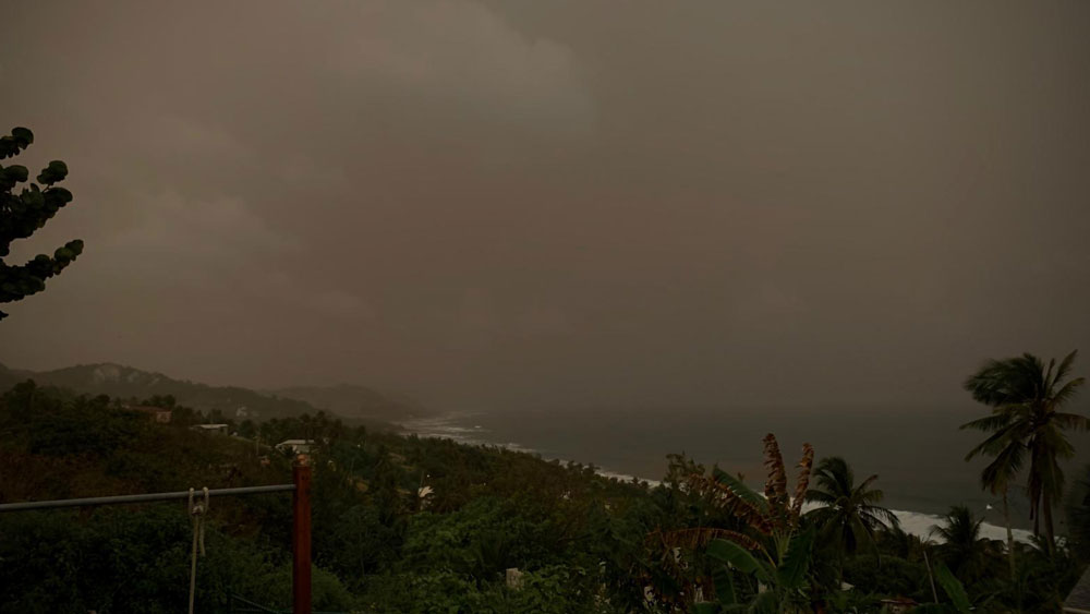 Cloud of dust over a beach