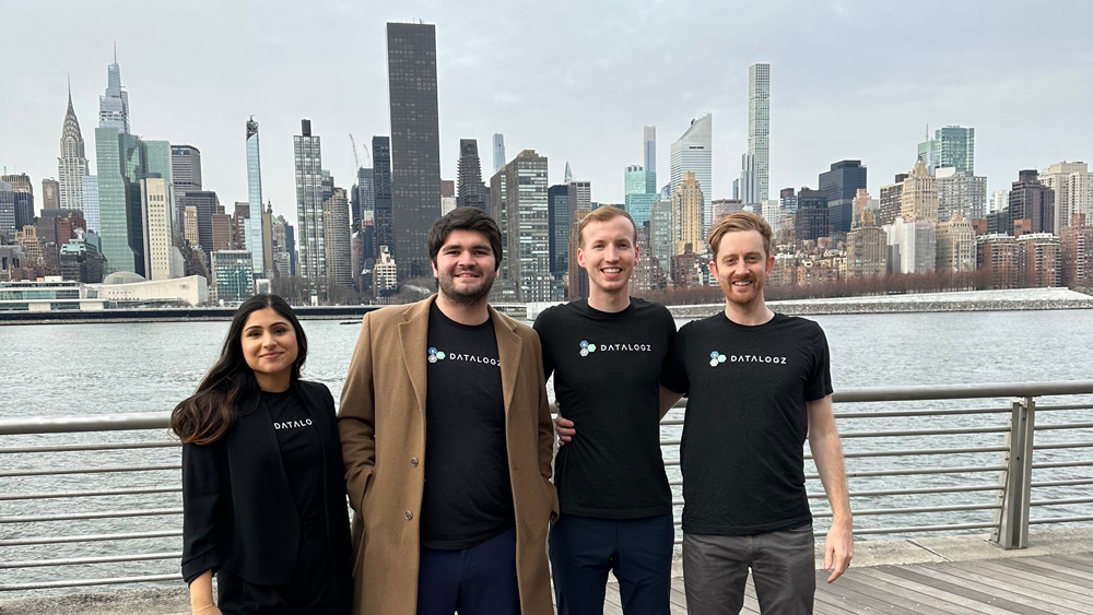 Logan Havern and his team stand on the pier in Long Island, New York, overlooking New York City.