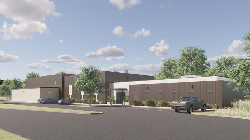 Front-view rendering of Nuclear Engineering Education Building against blue sky with trees and various landscaping. 