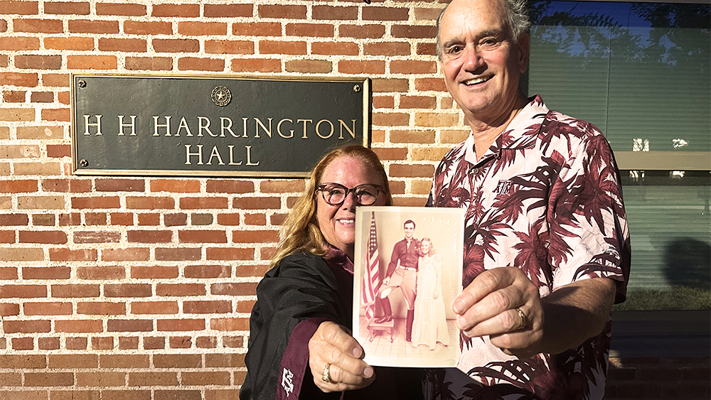 Kenneth and Denise Meyer holding a photo of themselves from 1975.