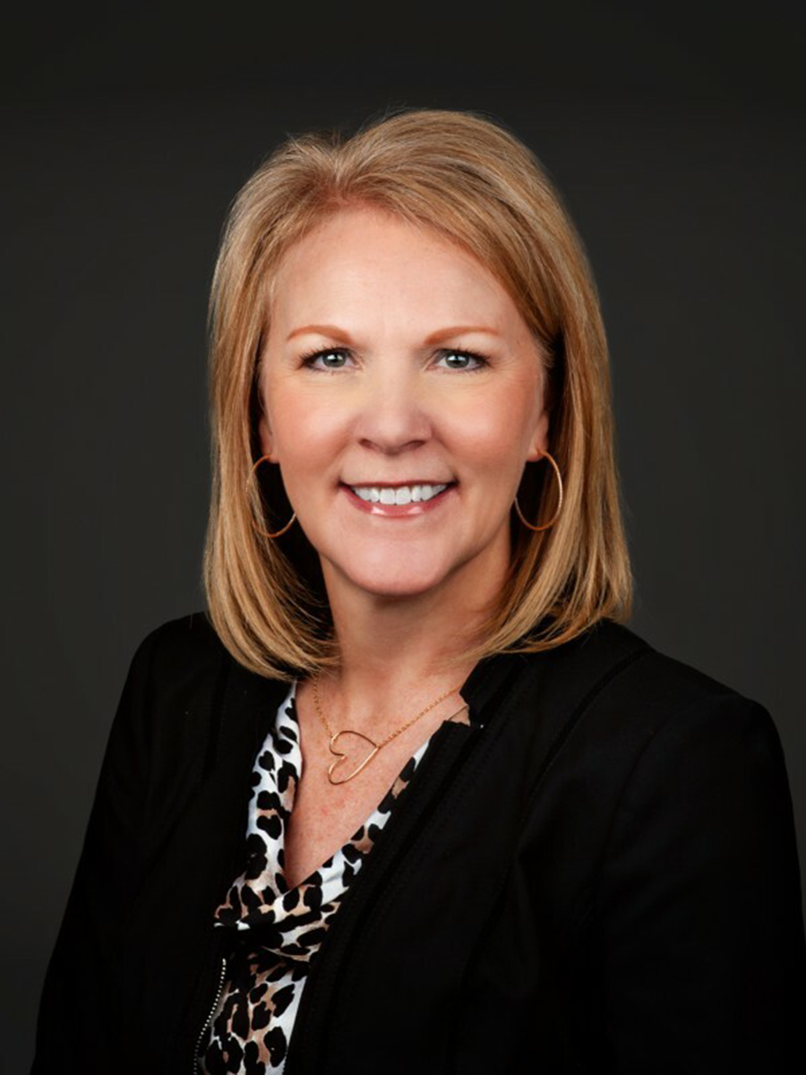 Headshot of a woman smiling.