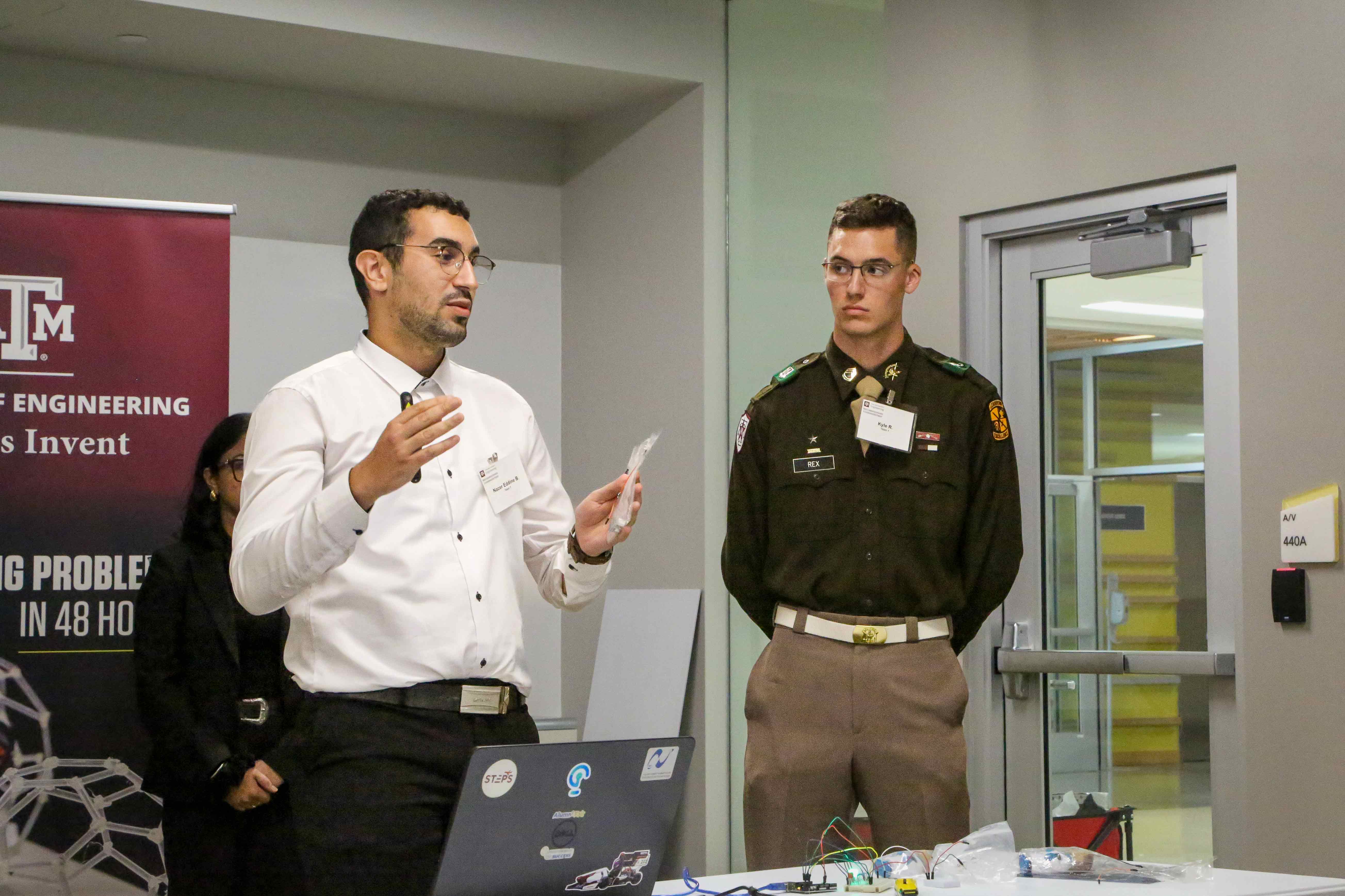 Two people standing while presenting.