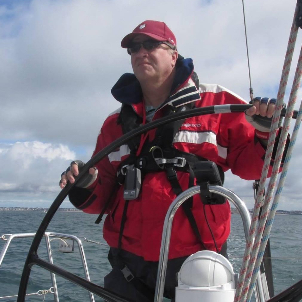 Man steering a boat.