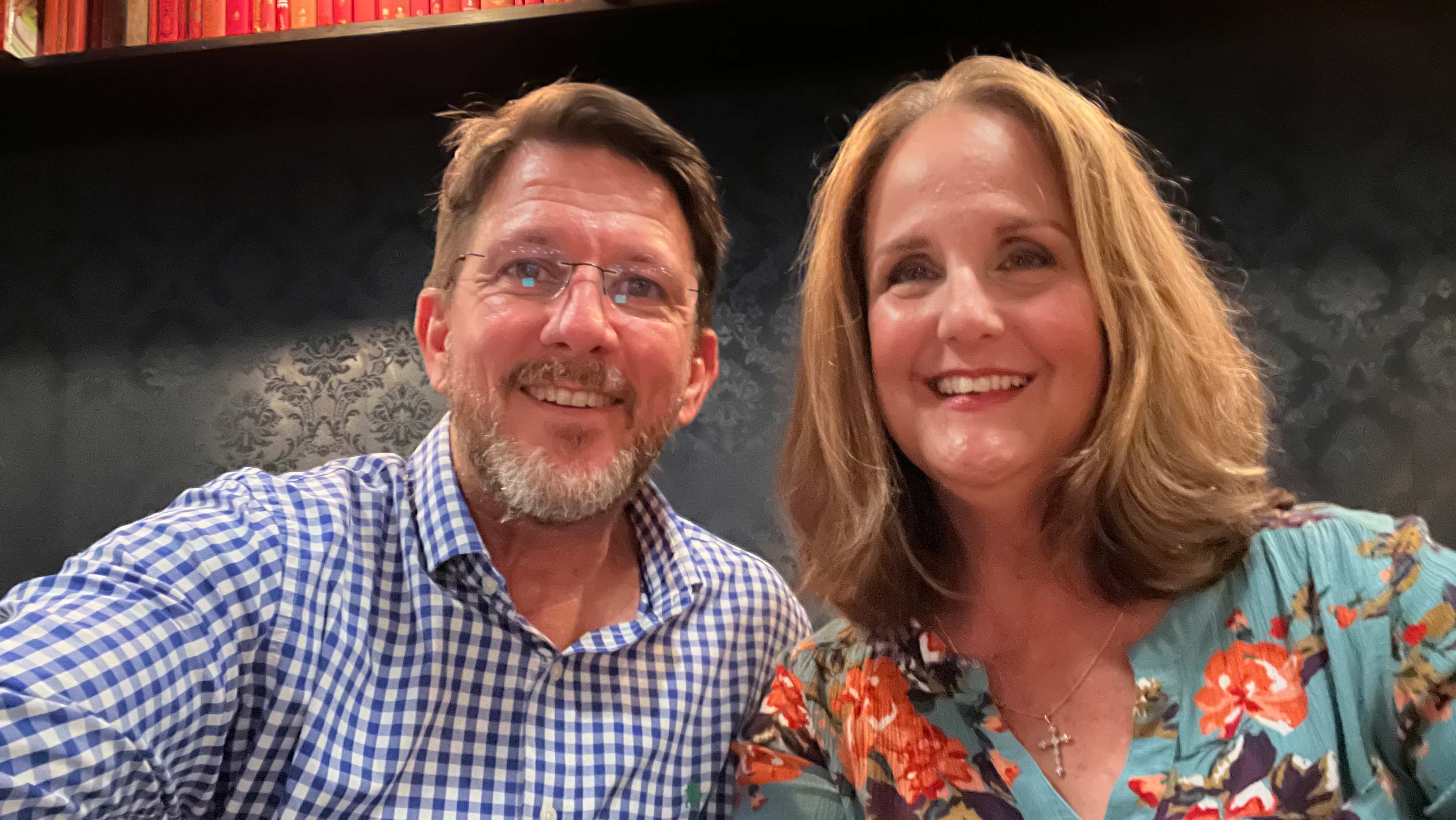A man and woman smiling for a photo.